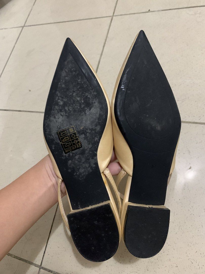 Dame Rose Beige Pointed Toe Slingback Flats Size 37 (Category: Flats & Sandals) located in Manila. Submitted by batibal (Listing ID 1471225097, Image 3). Description: - Brand: Dame Rose - Style: Pointed toe slingback flats with low block heel - Color: Versatile neutral beige - Material: Elegant satin finish upper with elastic strap - Size: 37 - Condition: Pre-loved with signs of wear on the sole; upper remains in great shape - Origin: Made in P.R