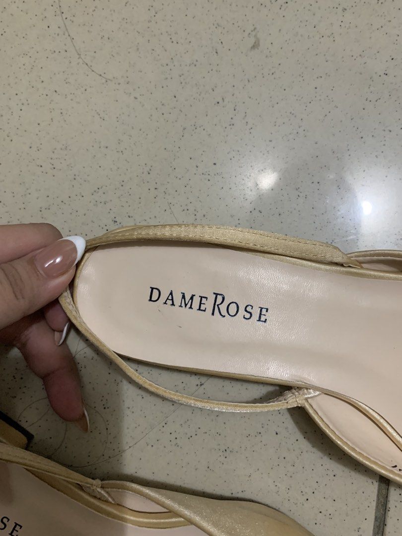 Dame Rose Beige Pointed Toe Slingback Flats Size 37 (Category: Flats & Sandals) located in Manila. Submitted by batibal (Listing ID 1471225097, Image 2). Description: - Brand: Dame Rose - Style: Pointed toe slingback flats with low block heel - Color: Versatile neutral beige - Material: Elegant satin finish upper with elastic strap - Size: 37 - Condition: Pre-loved with signs of wear on the sole; upper remains in great shape - Origin: Made in P.R