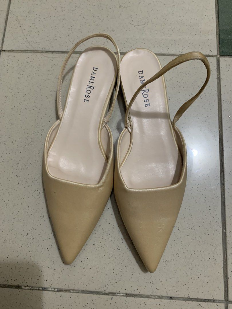 Dame Rose Beige Pointed Toe Slingback Flats Size 37 (Category: Flats & Sandals) located in Manila. Submitted by batibal (Listing ID 1471225097, Image 1). Description: - Brand: Dame Rose - Style: Pointed toe slingback flats with low block heel - Color: Versatile neutral beige - Material: Elegant satin finish upper with elastic strap - Size: 37 - Condition: Pre-loved with signs of wear on the sole; upper remains in great shape - Origin: Made in P.R