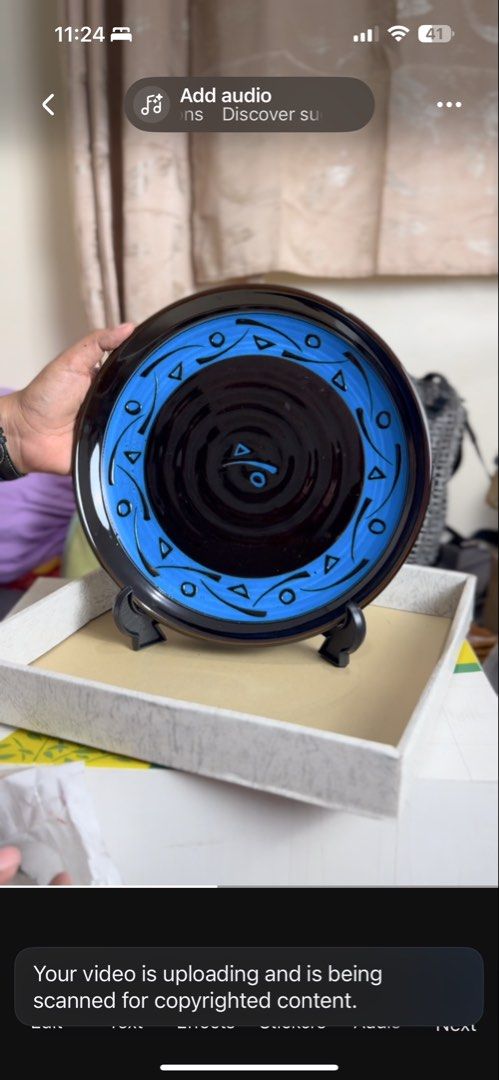 Decorative ceramic display plate with blue and black patterns (Category: Dinnerware & Cutlery) located in Masinloc. Submitted by kristineba02273 (Listing ID 1471270951, Image 2). Description: - Stunning decorative ceramic plate featuring a glossy black center with concentric circles and a stylized blue symbol - Vibrant blue outer rim detailed with geometric shapes, triangles, and circles - Includes a sleek black display stand for easy setup - Bea
