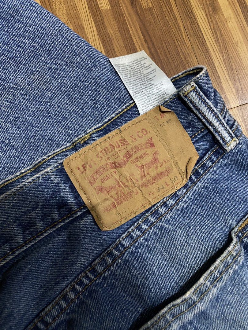 Denim Jeans (Category: Jeans) located in Manila. Submitted by ellieeeeee0293929 (Listing ID 1471122258, Image 2). Description: - Brand/Model: Classic Levi's 501 Jeans - Wash: Medium wash with slight fading from regular wear - Size: W34 L50 - Fit: Straight leg - Details: Button fly closure, traditional five-pocket design, and iconic leather back patch - Condition: Durable denim build, solid everyday piece.