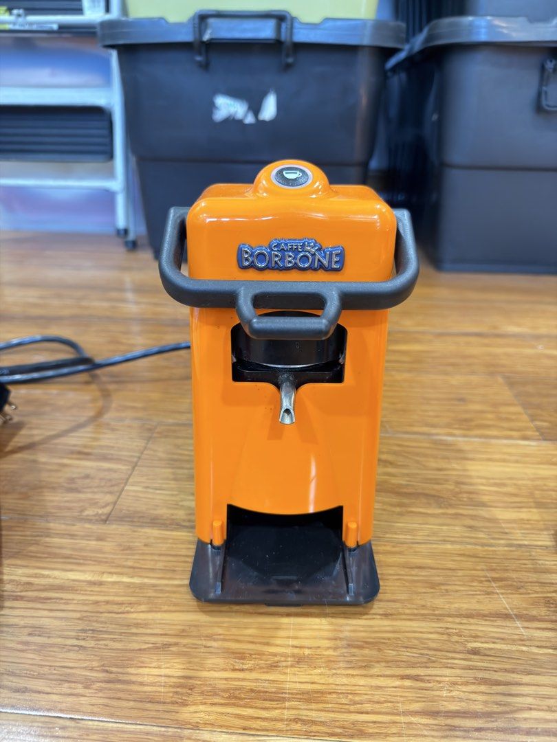 Didiesse Coffee Pod Machine (Category: Coffee Machines & Makers) located in Manila. Submitted by kelvs1435 (Listing ID 1471189213, Image 2). Description: - Model: Didiesse Frog Revolution Coffee Pod Machine - Color: Vibrant orange with stylish black housing - Compatibility: Standard 38 mm or 44 mm coffee pods (450W power) - Inclusions: Detachable water tank, drip tray grill, internal parts, and original box - Condition: Well-maintained, complete 