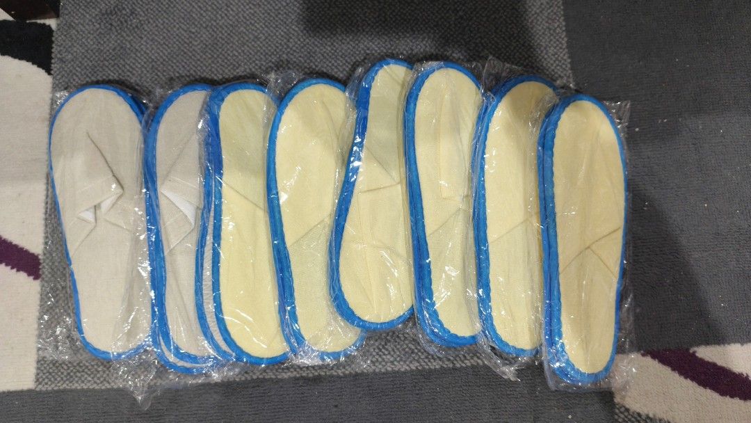 Disposable Hotel Slippers Yellow and White Bulk Pack (Category: Slippers and slides) located in Manila. Submitted by aaronpaula05546 (Listing ID 1471188263, Image 1). Description: - Set of disposable slippers, individually wrapped in hygienic plastic - Color: Yellow and white fabric with stylish blue trim 8pcs - Design: Open-toe and lightweight build for maximum comfort - Versatile use: Ideal for guest rooms, travel, hotels, or home spa days - Bu