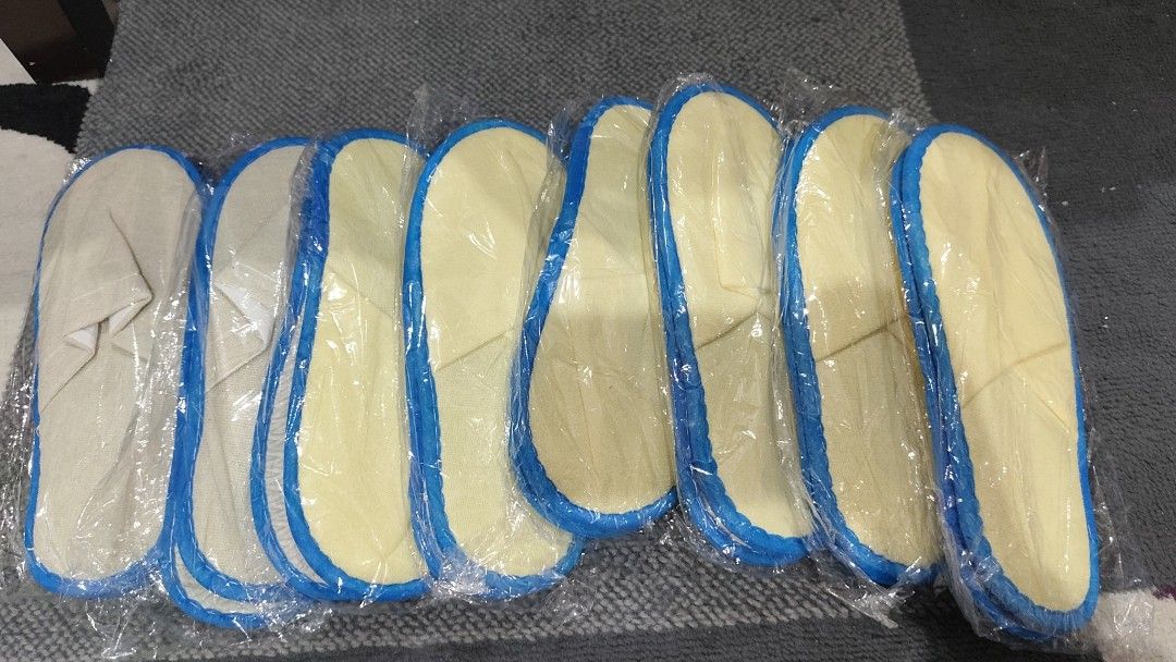 Disposable Hotel Slippers Yellow and White Bulk Pack (Category: Slippers and slides) located in Manila. Submitted by aaronpaula05546 (Listing ID 1471188263, Image 2). Description: - Set of disposable slippers, individually wrapped in hygienic plastic - Color: Yellow and white fabric with stylish blue trim 8pcs - Design: Open-toe and lightweight build for maximum comfort - Versatile use: Ideal for guest rooms, travel, hotels, or home spa days - Bu