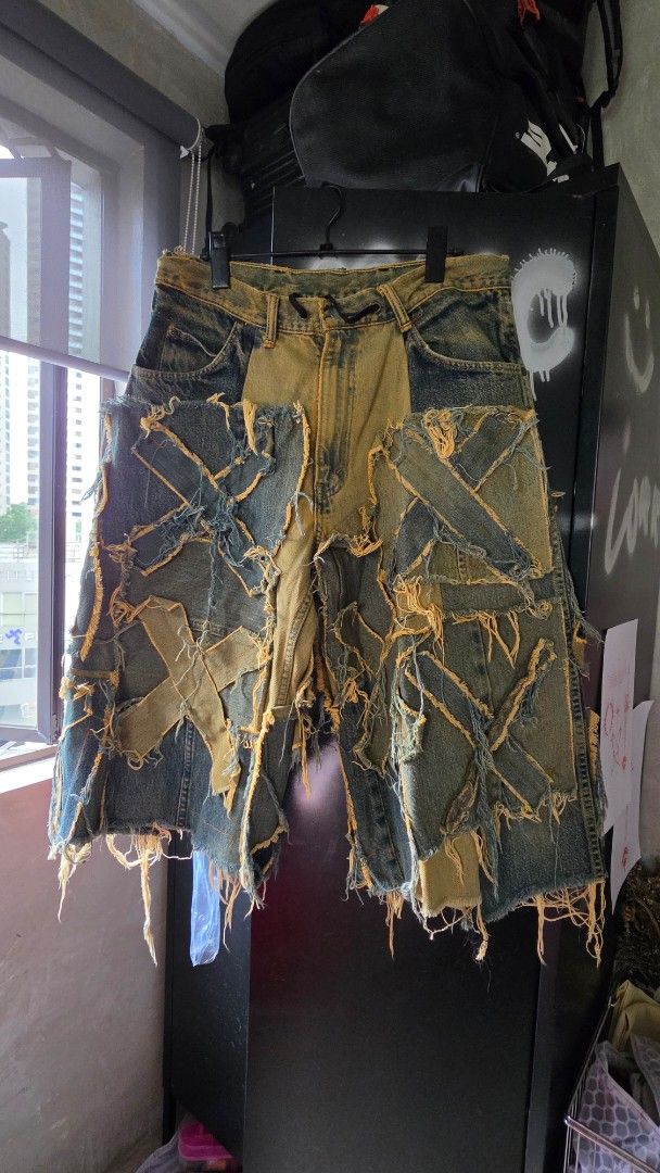 Distressed Patchwork Denim Shorts Streetwear Style (Category: Shorts) located in Muntinlupa City. Submitted by nat.m.cordoba (Listing ID 1471160125, Image 1). Description: - Style: Grunge aesthetic / Statement piece - Design: Heavy distressing and patchwork - length is knee-below the knee purchased in Bangkok, unisex. will fits S (tied with heavy scrunching, but works well with the style) to semi-L on women. .