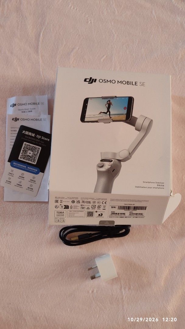 DJI Osmo Mobile SE Smartphone Stabilizer (Category: Gimbals & Stabilizers ) located in Bacolod City. Submitted by goldeneagle_b6da9f (Listing ID 1471217567, Image 2). Description: - Item: DJI Osmo Mobile SE Handheld Smartphone Gimbal - Color: Gray - Condition: Excellent, complete with original retail box - Inclusions: Stabilizer unit, mini tripod stand, charging cable, power adapter, and manuals - Features: Perfect for cinematic steady video reco