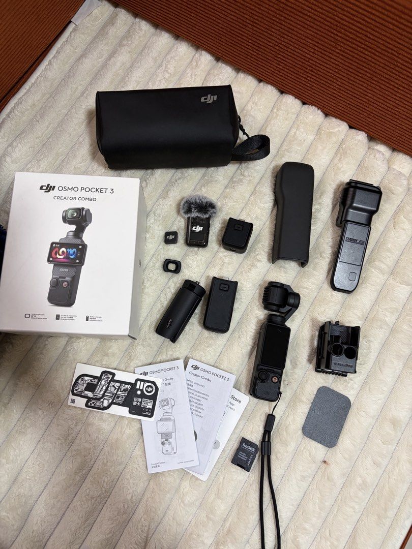 DJI Osmo Pocket 3 Creator Combo (Category: Cameras) located in Angono. Submitted by thingsbyzia (Listing ID 1471167800, Image 1). Description: - DJI Osmo Pocket 3 Creator Combo kit - Includes Pocket 3 camera, Mic 2 transmitter + deadcat, battery handle, and wide-angle lens - Comes with protective cover, mini tripod, carrying bag, manual, and SanDisk microSD adapter - Complete with original box and all accessories - Clean condition and ready to us