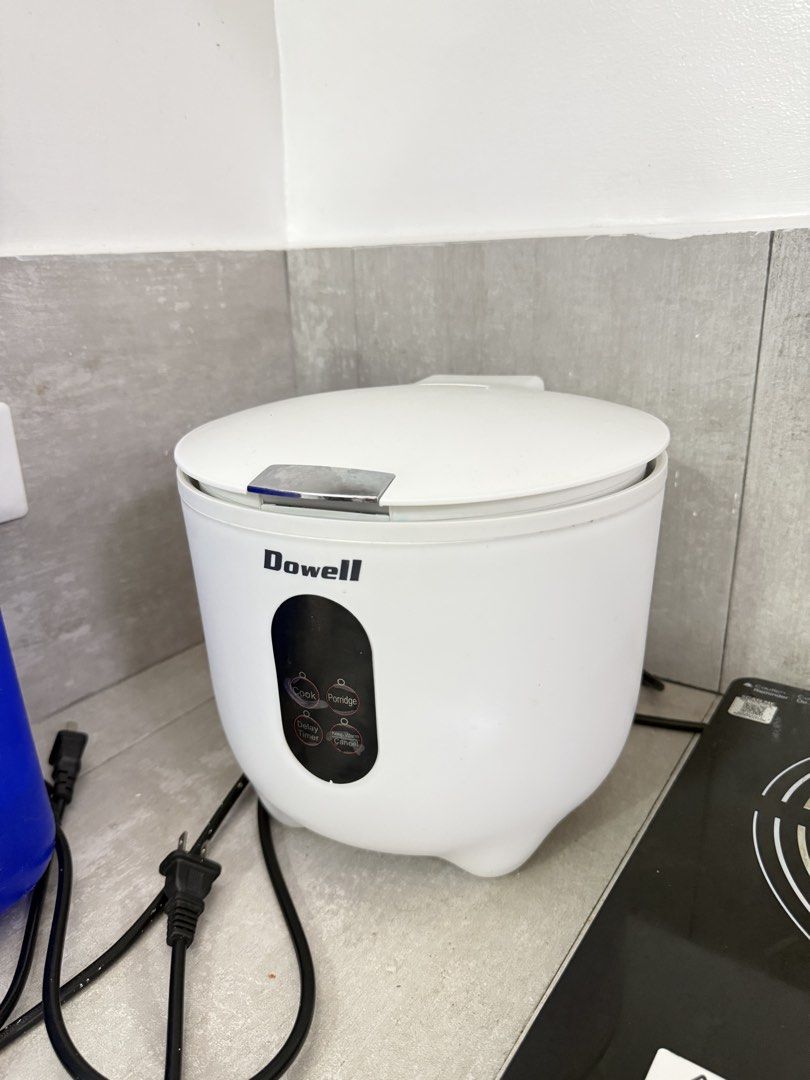 Dowell RC-5UP 5-Cup Digital Rice Cooker (Category: Cookers) located in Manila. Submitted by k.e9999 (Listing ID 1471260288, Image 1). Description: Purchased brand new last March 2026 - Brand: Dowell - Capacity: 5-cup (perfect for small households or daily use) - Color: Clean white with a modern digital display panel - Functions: Cook, porridge, delay timer, and keep warm - Includes: Non-stick inner pot and standard power cord - Condition: Working