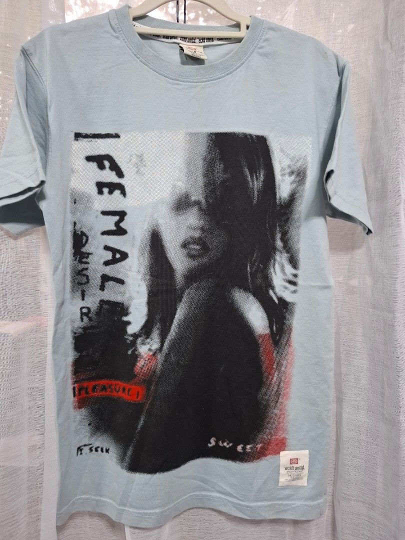 Ecko Unltd Graphic T-Shirt Light Blue Size S (Category: Tshirts & Polo Shirts ) located in Manila. Submitted by jazil.ladyliz (Listing ID 1471196939, Image 2). Description: - Brand: Ecko Unltd - Size: S (Regular fit) - Color: Light blue - Material: 100% cotton - Design: Front graphic print with female face art, 'FEMALE' text, and red accent patch - Details: Woven brand tags at the bottom hem and back collar - Condition: Excellent pre-loved find.