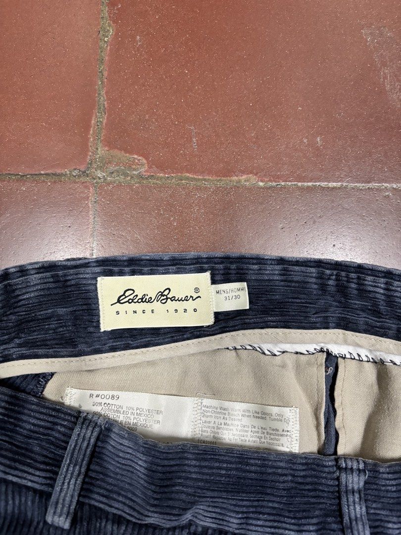 Eddie Bauer Blue Corduroy Pleated Pants Size (Category: Trousers) located in Manila. Submitted by mharkie (Listing ID 1471285213, Image 3). Description: - Brand/Model: Eddie Bauer Pleated Corduroy Pants - Color: Dark Blue - Size: 31/30 - Material: 90% Cotton, 10% Polyester - Origin: Made in Mexico - Fit & Texture: Comfortable relaxed fit with wide whale texture - Features: Button-closure back pockets and waist belt loops - slightly discoloration 