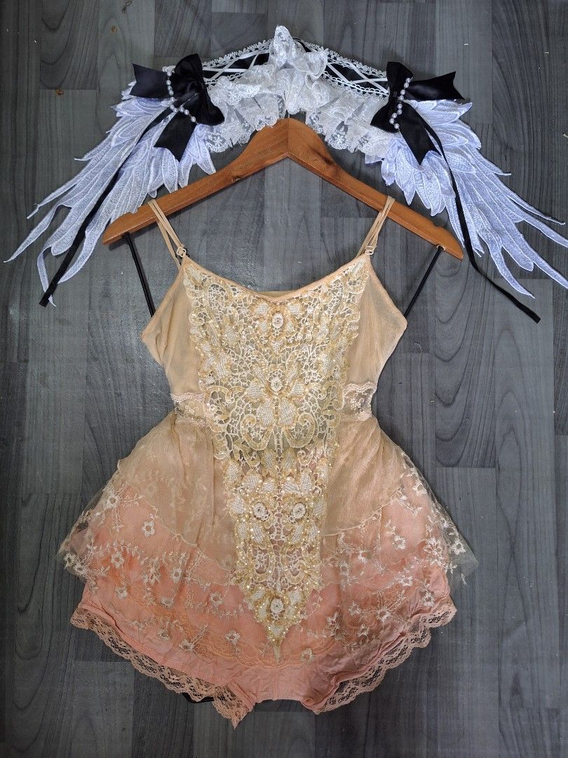 Fairy Cosplay Outfit Sequin Top Wings Set (Category: Sets or Coordinates) located in Manila. Submitted by irramay0064845 (Listing ID 1471141249, Image 1). Description: - Complete fairy cosplay set ready to wear - Includes peach and silver sequin tops and layered lace shorts - Comes with angel wings featuring black ribbon bows and pearl strands - Includes matching lace headbands - Versatile pieces with multiple styling options - Ideal for parties,