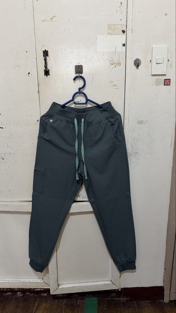 FIGS Scrubs in Bonsai (Category: Sets or Coordinates) located in Davao. Submitted by tacoling (Listing ID 1471134901, Image 3). Description: - Brand/Collection: FIGS Technical Collection - Color: bonsai - Size: XS catarina top, XS/petite HW zamora joggers - Top: V-neck with convenient chest pocket - Pants: Drawstring waistband, multiple pockets, and stylish cuffed ankles - Origin: Made in Jordan - rfs: not used no stains.
