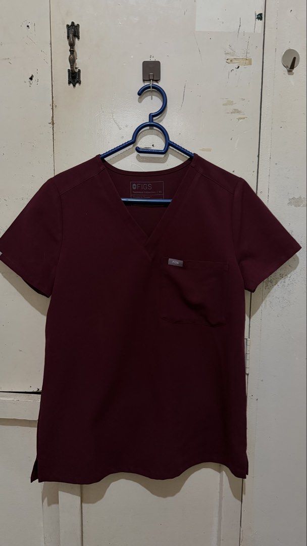 FIGS scrubs in Burgundy (Category: Sets or Coordinates) located in Davao. Submitted by tacoling (Listing ID 1471135075, Image 1). Description: - Brand: FIGS Technical Collection - Color: Burgundy - Size: XS (Top and Bottom Set) petite bottoms HW - Top: Deep V-neck with chest pocket - Pants: Elastic waistband with adjustable drawstring and multiple functional pockets - Material: Super comfortable high-performance fabric - Condition: Great addition