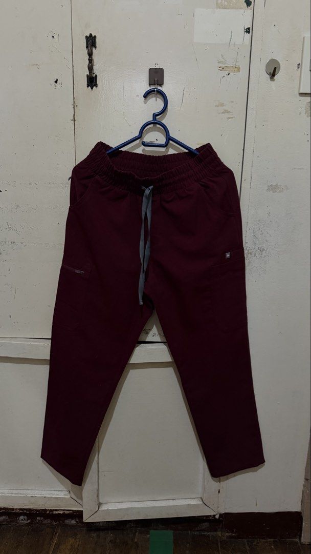 FIGS scrubs in Burgundy (Category: Sets or Coordinates) located in Davao. Submitted by tacoling (Listing ID 1471135075, Image 3). Description: - Brand: FIGS Technical Collection - Color: Burgundy - Size: XS (Top and Bottom Set) petite bottoms HW - Top: Deep V-neck with chest pocket - Pants: Elastic waistband with adjustable drawstring and multiple functional pockets - Material: Super comfortable high-performance fabric - Condition: Great addition