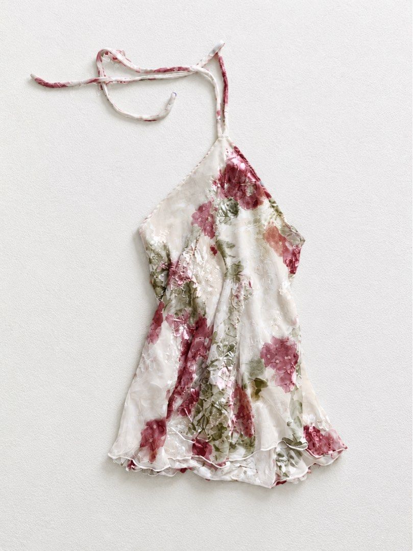 Floral Halter Top with Lettuce Hem (Category: Sleeveless) located in Sarangani. Submitted by solune_clo (Listing ID 1471196795, Image 1). Description: - Design: Pink and green floral print on sheer white fabric - Fit: Halter neck with tie closure and sleeveless open-back design - Details: Delicate lettuce trim along the bottom hem - Material: Lightweight and flowy, ideal for warm weather or layering - Condition: Excellent pre-loved condition (Bra