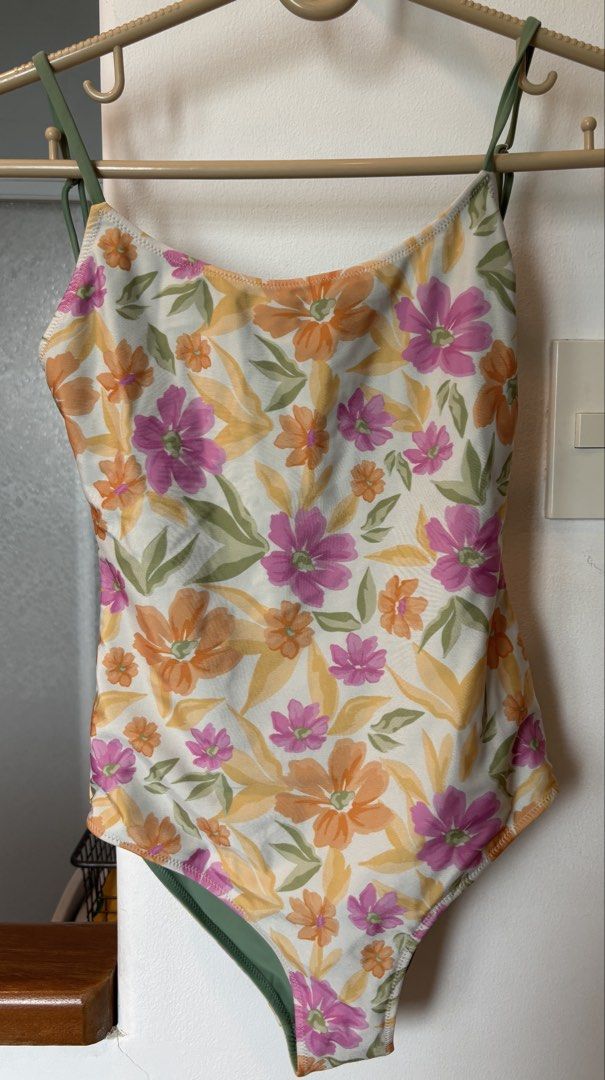 Floral One-Piece Swimsuit (Category: Bikinis & Swimsuits) located in Muntinlupa City. Submitted by danir918 (Listing ID 1471186589, Image 1). Description: - Cream floral one-piece swimsuit with pink, orange, and yellow flowers - Adjustable spaghetti straps with metal sliders for a custom fit - Scoop neckline and low scoop back design - store price: 2,000+ .