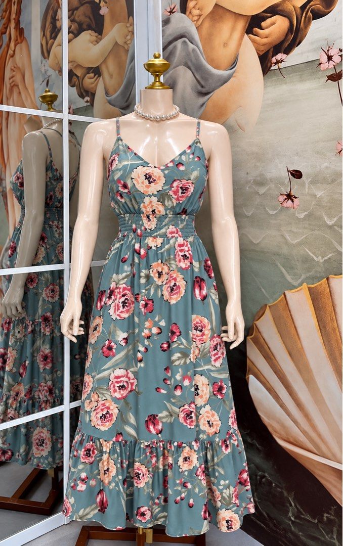 Floral Print Spaghetti Strap Maxi Dress (Category: Dresses) located in Subic. Submitted by ysbllrs (Listing ID 1471165339, Image 1). Description: - Color: Sage green with pink and peach floral prints - Style: Maxi dress with spaghetti straps and flared tiered ruffle hem - Comfort: Super comfortable smocked elastic waist, easy to slip on - Occasion: Great for warm weather days and casual outings - Fit: Flattering fit.