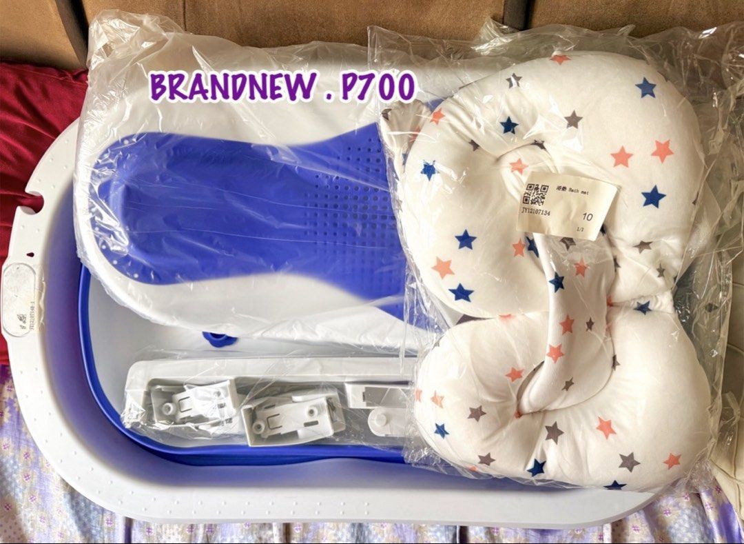 Foldable Baby Bathtub Set with Bath Cushion (Category: Bathtub & Bath Accessories) located in Pasay City. Submitted by lovedbyfrance (Listing ID 1471121297, Image 2). Description: - Brand new and still sealed in original plastic packaging - Color: Blue and white - Space-saving foldable design, ideal for home or travel - Includes foldable tub frame, support mesh seat, and star-patterned cushion pillow.