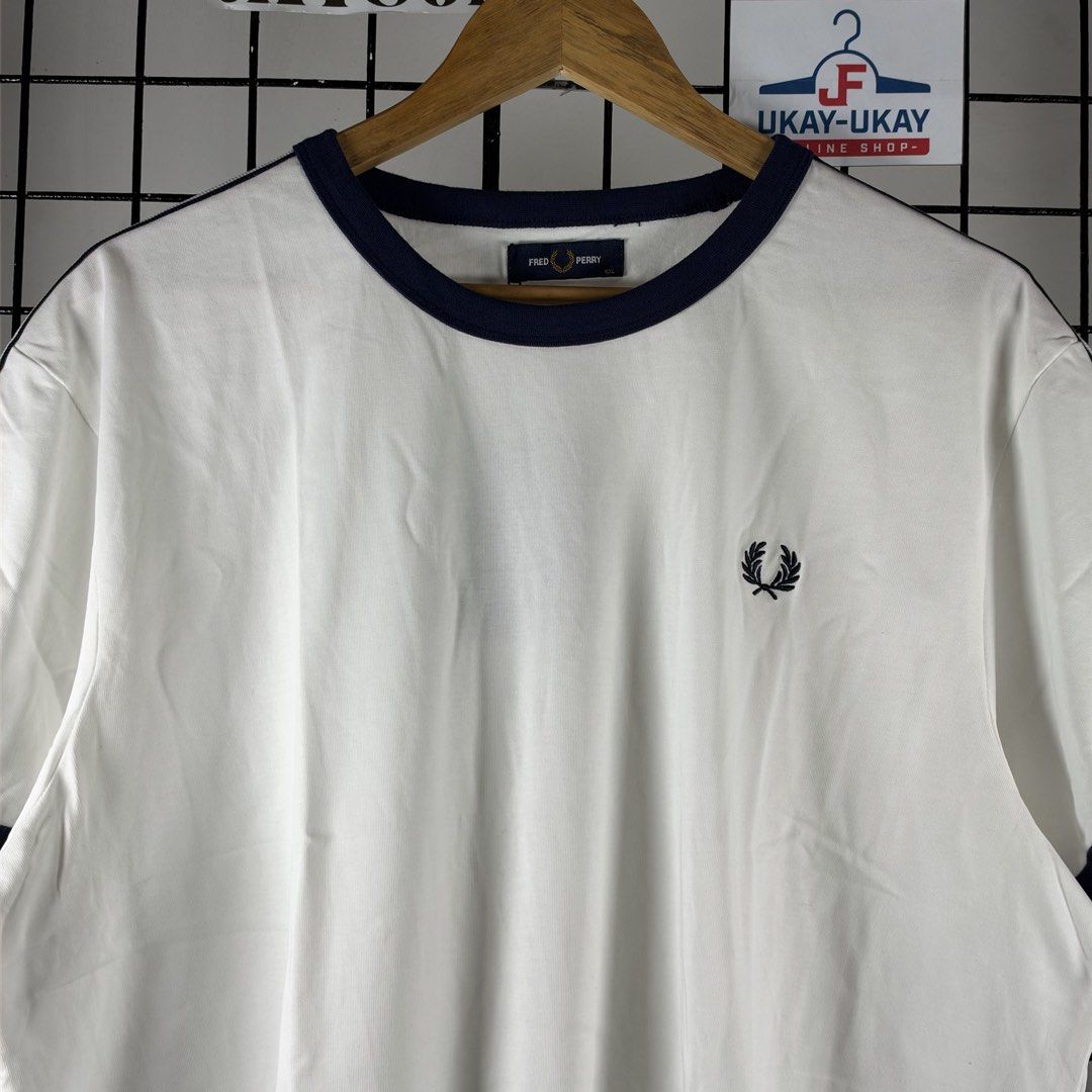 FRED PERRY SIDETAPE (Category: Activewear) located in Talavera. Submitted by puppyinsane (Listing ID 1471188142, Image 2). Description: XXL SIZE ON TAG FIT XL LENGTH: 25 WIDTH: 24.5 BRAND NEW & AUTHENTIC .