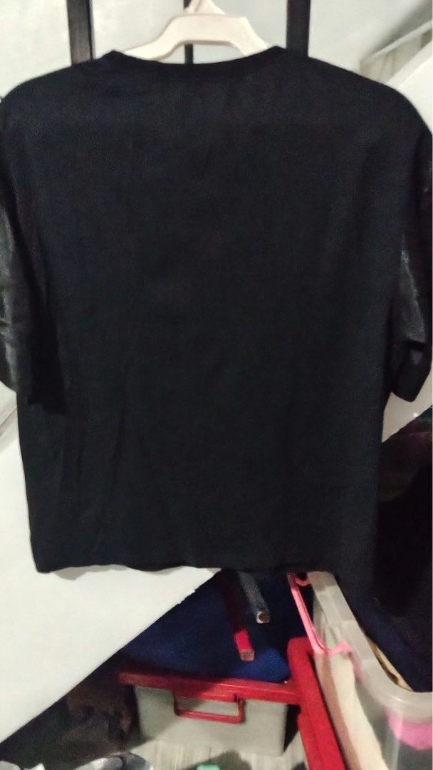 FRIFUL Black T-Shirt with Graphic Print Size M (Category: Blouses) located in Quezon City. Submitted by pickbuy.426 (Listing ID 1471184338, Image 3). Description: - Brand: FRIFUL - Size: M on tag but can fit to Large-XL - Material: 100% Cotton - Color: Solid black with large silver graphic print and typography on the front - Design: Crew neckline, plain solid back - Condition: Good as New - Care: Wash with like colors as per care label Used once 