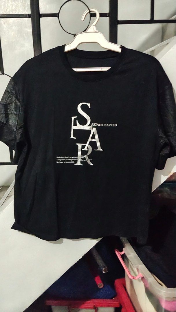 FRIFUL Black T-Shirt with Graphic Print Size M (Category: Blouses) located in Quezon City. Submitted by pickbuy.426 (Listing ID 1471184338, Image 1). Description: - Brand: FRIFUL - Size: M on tag but can fit to Large-XL - Material: 100% Cotton - Color: Solid black with large silver graphic print and typography on the front - Design: Crew neckline, plain solid back - Condition: Good as New - Care: Wash with like colors as per care label Used once 