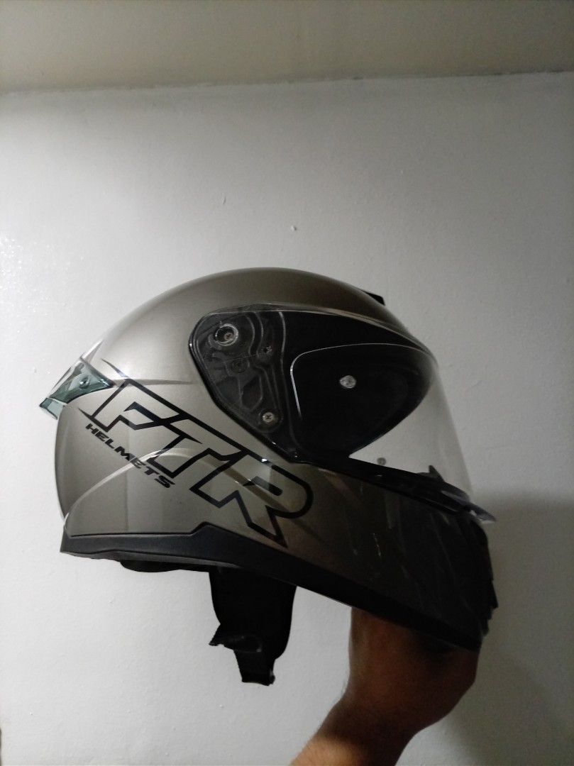 FTR Helmets Full Face Motorcycle Helmet Grey (Category: Bicycles) located in Manila. Submitted by kylecalvin65593 (Listing ID 1471259301, Image 1). Description: - Brand: FTR XR2 PRO Full Face Dual Visor Motorcycle Helmet - Color: Sleek Grey with bold FTR logos on both sides - Visors: Clear outer visor + dark inner sun visor (smooth opening/closing) - Ventilation: Front air vents at the chin and top for airflow - Closure: Convenient quick-release 