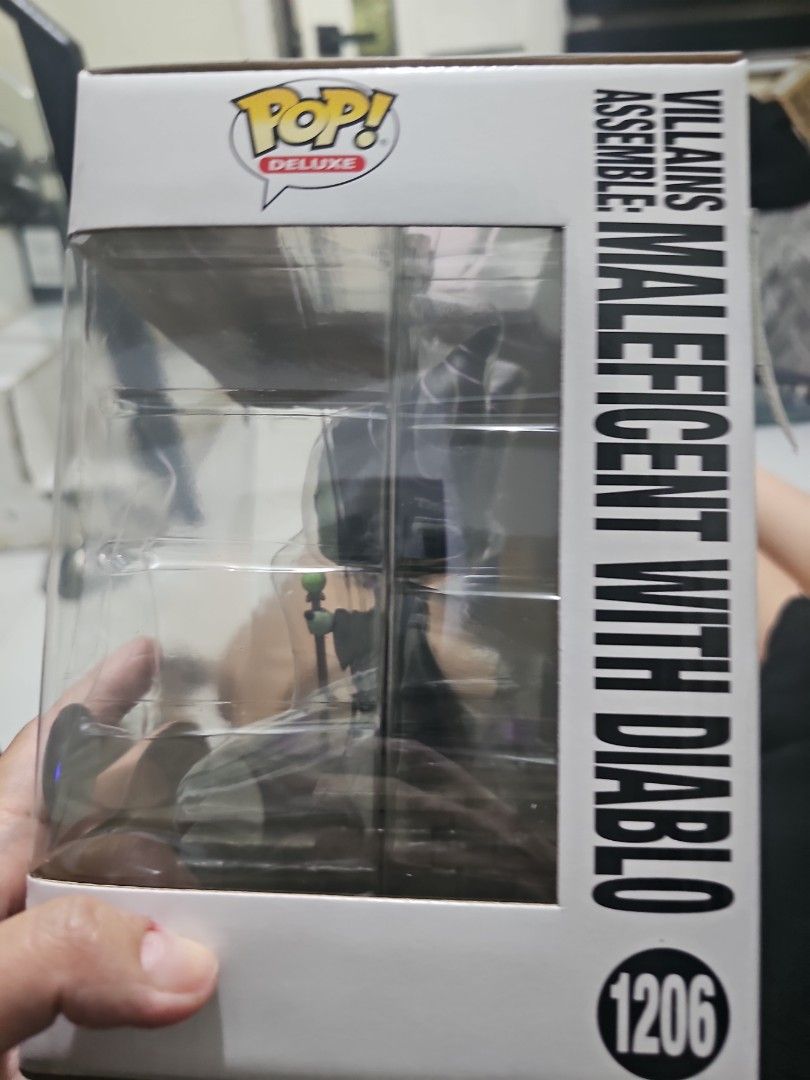 Funko Pop Deluxe 1206 MALEFICENT (Category: Designer & Blind Box Toys) located in Manila. Submitted by learni01 (Listing ID 1471214776, Image 2). Description: - Brand: Funko Pop Deluxe - Item Number: 1206 - Condition: Brand new, never opened, box kept intact - Packaging: Original green box with clear front display window - Special Feature: Features green jungle-themed background art inside.