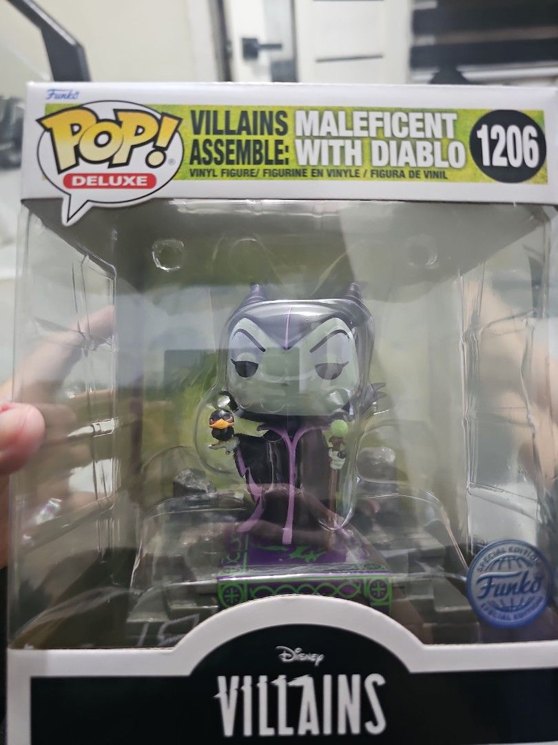 Funko Pop Deluxe 1206 MALEFICENT (Category: Designer & Blind Box Toys) located in Manila. Submitted by learni01 (Listing ID 1471214776, Image 1). Description: - Brand: Funko Pop Deluxe - Item Number: 1206 - Condition: Brand new, never opened, box kept intact - Packaging: Original green box with clear front display window - Special Feature: Features green jungle-themed background art inside.