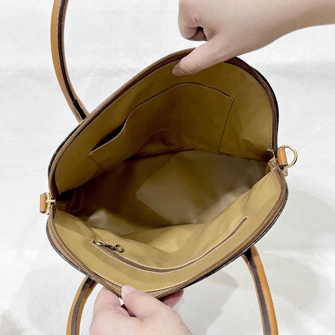 Genie Brown Monogram Polyvinyl Material Handbag (Category: Shoulder Bags) located in Antipolo. Submitted by aristokai (Listing ID 1471180965, Image 3). Description: ✅ NOTE: NO LONG STRAP ✅ Like new and in good condition! .