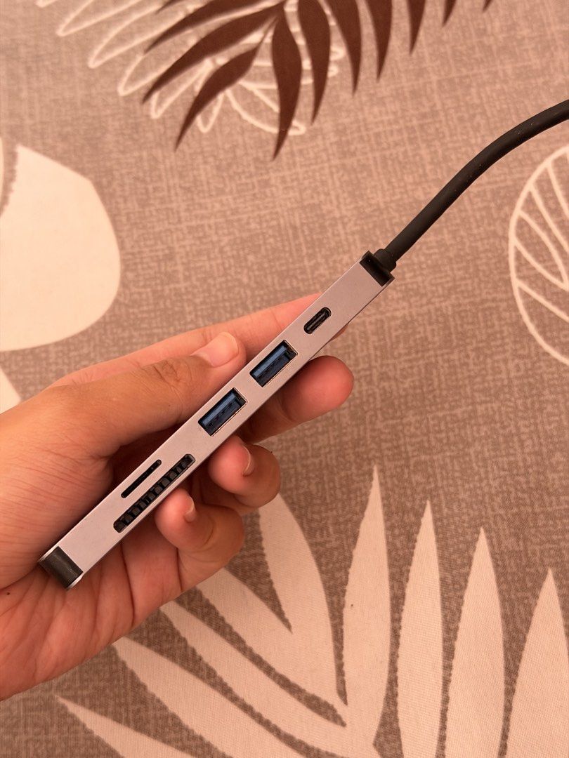 GOOJODOQ Multi-Port USB-C Hub Adapter (Category: Cables & Adaptors) located in Munoz. Submitted by shop.holiic (Listing ID 1471130996, Image 2). Description: - Brand: GOOJODOQ - Color: Grey - Condition: Barely used, works great - Ports: USB-A, USB-C, Card Reader, and HDMI - Connection: Attached Type-C cable - Compatibility: Great for laptops and tablets Not using anymore Still working MOP: Gcash/Maribank Nueva Ecija .