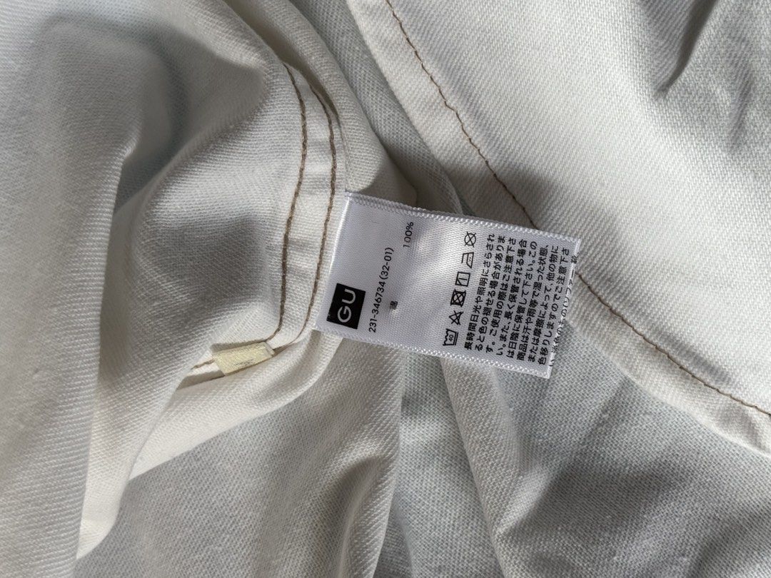 GU White Short Sleeve Button-Down Shirt (Category: Shirts) located in Quezon City. Submitted by mymelodylvr (Listing ID 1471286538, Image 3). Description: - Brand: GU - Color: Classic White - Material: 100% Cotton - Details: Short sleeves, button-down collar, single chest pocket, curved hem - Condition: Good overall, but please note small stains on the front pocket - Style: Casual basic top, easy to pair with denim or shorts.