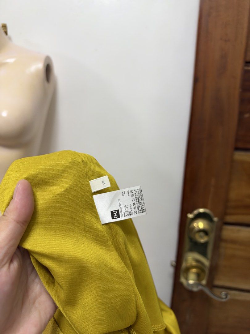 GU Yellow Midi Skirt with Front Slit Size S (Category: Skirts) located in Cavite. Submitted by yakultjeni85475 (Listing ID 1471285246, Image 3). Description: - Brand: GU - Size: S (Tag attached) - Color: Bright yellow - Style: Pencil silhouette with front slit detail - Condition: Brand new with tags - Versatile piece for office or casual wear.