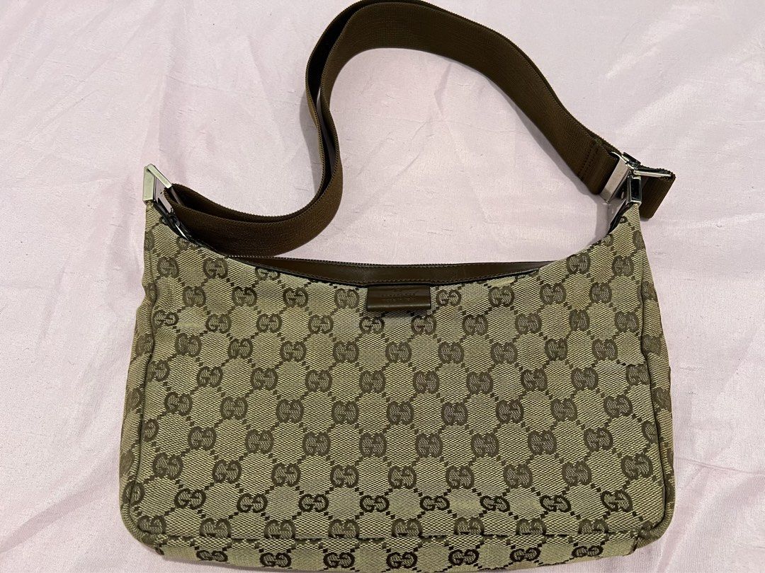 Gucci Monogram Canvas Shoulder Bag Brown (Category: Luxury Bags & Wallets) located in Manila. Submitted by czaaay (Listing ID 1471125104, Image 1). Description: - 100% Authentic Gucci monogram canvas shoulder bag in classic brown - Features durable dark brown leather trim and silver-tone hardware - Adjustable fabric strap for comfortable wear - Secure zip top closure - Spacious interior compartment, perfect for daily essentials - Condition: Excel