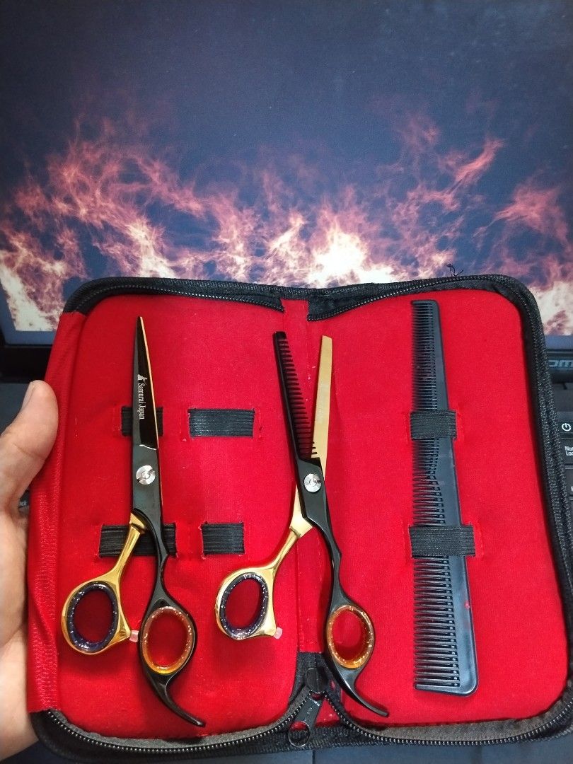 Hair Cutting Scissors Thinning Shears Set with Case (Category: Hair) located in Manila. Submitted by junaid23 (Listing ID 1471174954, Image 2). Description: - Complete hair styling kit for home use or grooming practice - Includes straight scissors, thinning shears, and a black comb - Durable stainless steel construction with comfortable finger rings - Comes in a compact red zipped storage case for easy organization - Brand new and ready to use.