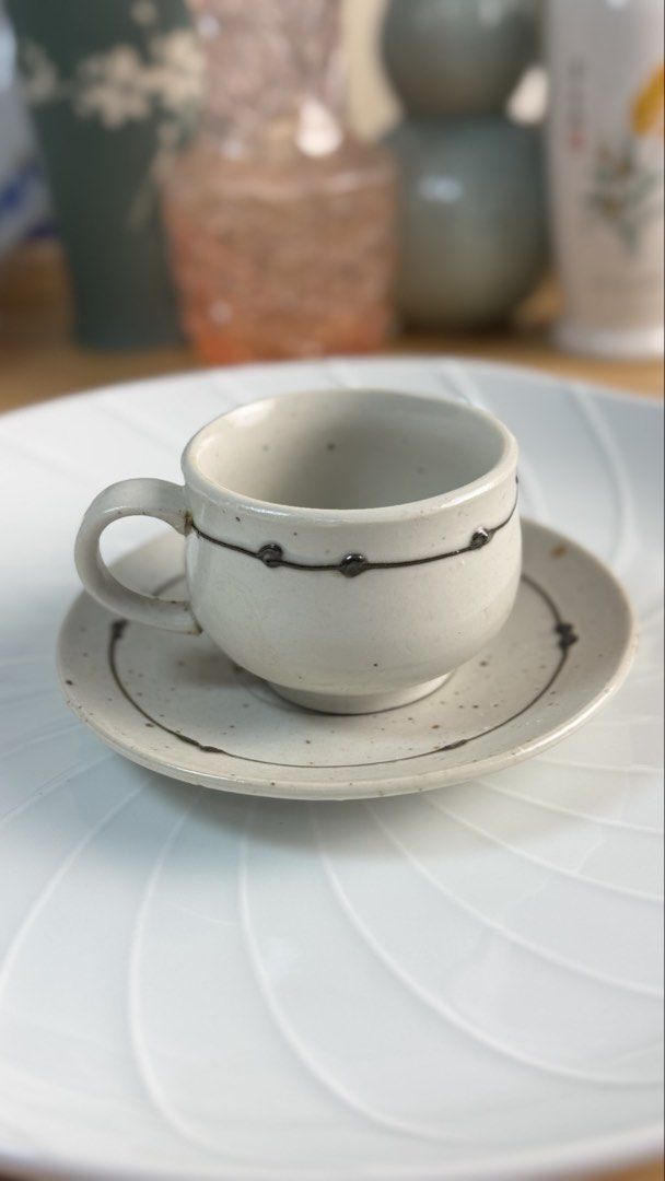 Handmade Ceramic Speckled Coffee Cup and Saucer Set (Category: Coffee & Tea Tableware) located in Masinloc. Submitted by kristineba02273 (Listing ID 1471146339, Image 2). Description: - Handmade ceramic set includes 5 cups and matching saucers - Beautiful off-white speckled glaze finish - Stylish dark brown line and raised dot accents - Designed with sturdy handles for a comfortable grip - Perfect for morning coffee or afternoon tea.