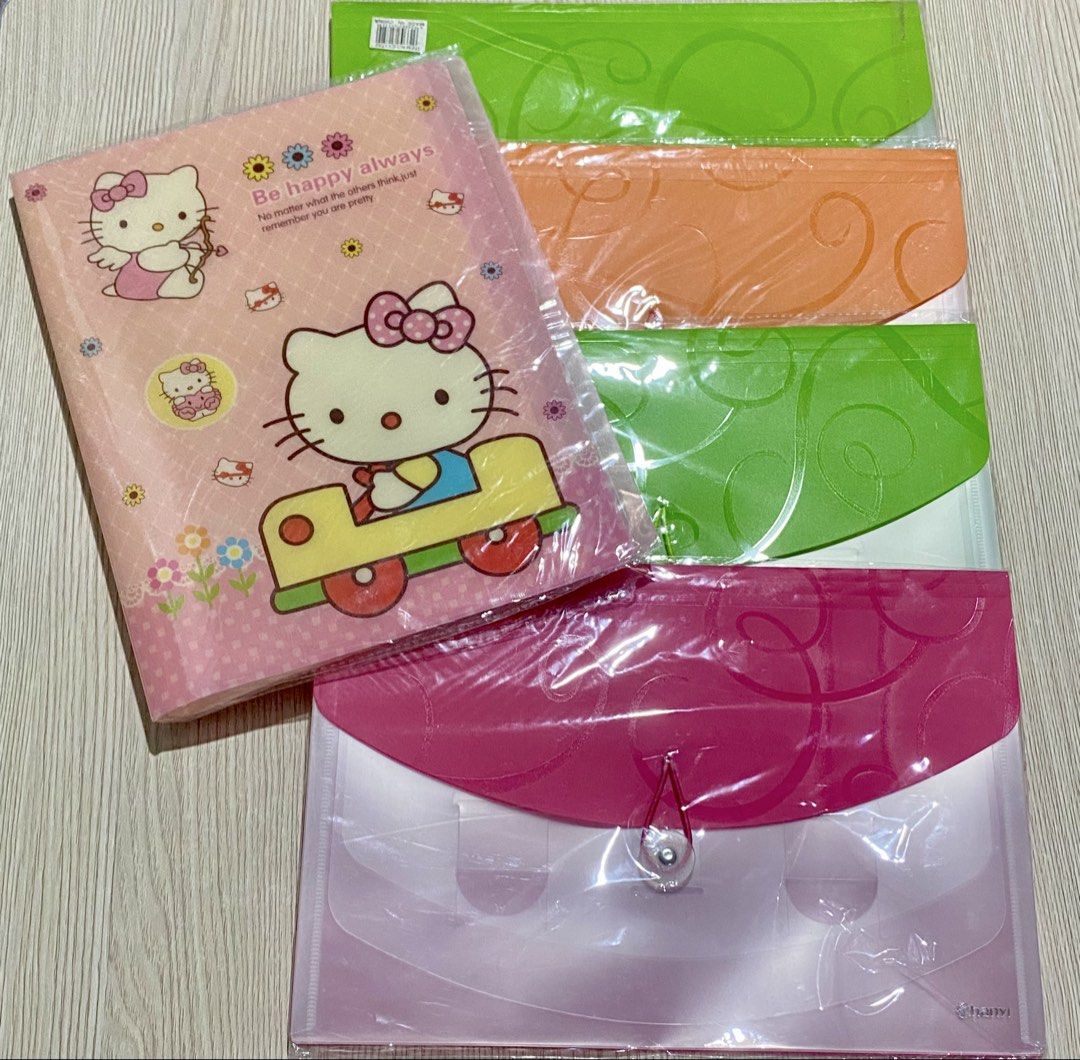 Hello Kitty clear file folder and colorful expanding file folders bundle (Category: Stationery & School Supplies) located in Manila. Submitted by vdeclutters6 (Listing ID 1471284968, Image 1). Description: - All for 200 - Kitty pink folder with cute front quote - Includes translucent plastic expanding document folders in green, orange, and pink - Features secure button string closures - Ideal for organizing papers, bills, and school notes - Brand