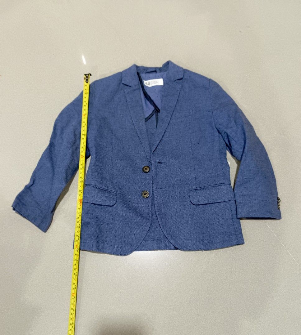 H&M Blue Suit Jacket Blazer Kids (Category: Babies & Kids Fashion) located in Santa Rosa. Submitted by chindeclutters (Listing ID 1471260398, Image 1). Description: - Brand: H&M - Color: Blue - Style: Two-button closure with side flap pockets - Lining: Cute dotted pattern inside - Fabric: Lightweight texture - Measurements: Chest width ~34 cm, Total length ~52 cm - Occasion: Perfect for formal events or smart casual wear - used a few times, in go