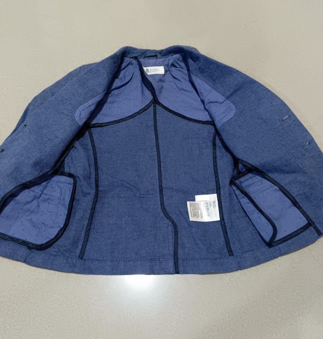 H&M Blue Suit Jacket Blazer Kids (Category: Babies & Kids Fashion) located in Santa Rosa. Submitted by chindeclutters (Listing ID 1471260398, Image 2). Description: - Brand: H&M - Color: Blue - Style: Two-button closure with side flap pockets - Lining: Cute dotted pattern inside - Fabric: Lightweight texture - Measurements: Chest width ~34 cm, Total length ~52 cm - Occasion: Perfect for formal events or smart casual wear - used a few times, in go