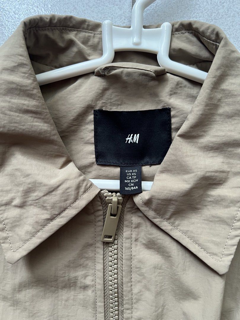 H&M Khaki Harrington Jacket Size XS (Category: Coats, Jackets and Outerwear) located in Manila. Submitted by raypeppa (Listing ID 1471149730, Image 2). Description: - SRP: 2490 PHP - Selling for only 1800 - Used Once - Brand: H&M - Color: Khaki beige - Size: Extra Small (XS) - Chest width: ~20 inches -Length ~25 inches - Features: Full zip front, lapel collar, ribbed hem & cuffs, dual front flap pockets - Condition: Clean, hardly worn.