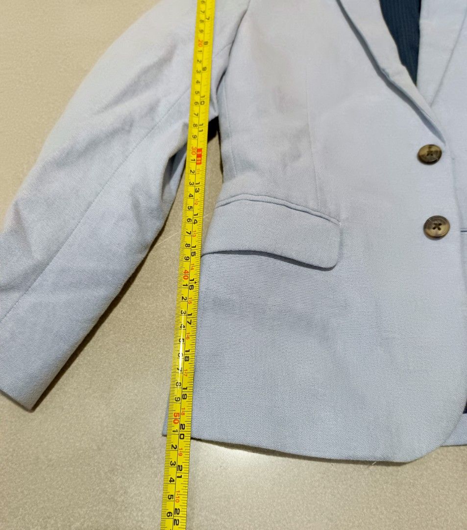 H&M Light Blue Blazer Jacket kids (Category: Babies & Kids Fashion) located in Santa Rosa. Submitted by chindeclutters (Listing ID 1471260572, Image 3). Description: - Brand: H&M - Color: Light blue with dark blue vertical striped inner lining - Closure: Two-button front - Pockets: Two side flap pockets, one welt chest pocket - Measurements: Length 23", Sleeve 22.5", Shoulder-to-shoulder 16" - Condition: good and ready to wear - Style: Ideal for 