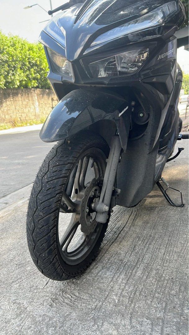 Honda Click Motorcycle Scooter Black (Category: Motorbikes for Sale) located in Carmona. Submitted by tvnx746r5z (Listing ID 1471133985, Image 3). Description: Black Honda Click scooter in solid working order. Clean body panels and clear digital instrument cluster showing 5,930 kilometers total mileage. Equipped with front disc brakes, comfortable mesh seat cover, and phone mount on the handlebars. Liquid-cooled engine. Standard factory alloy whe