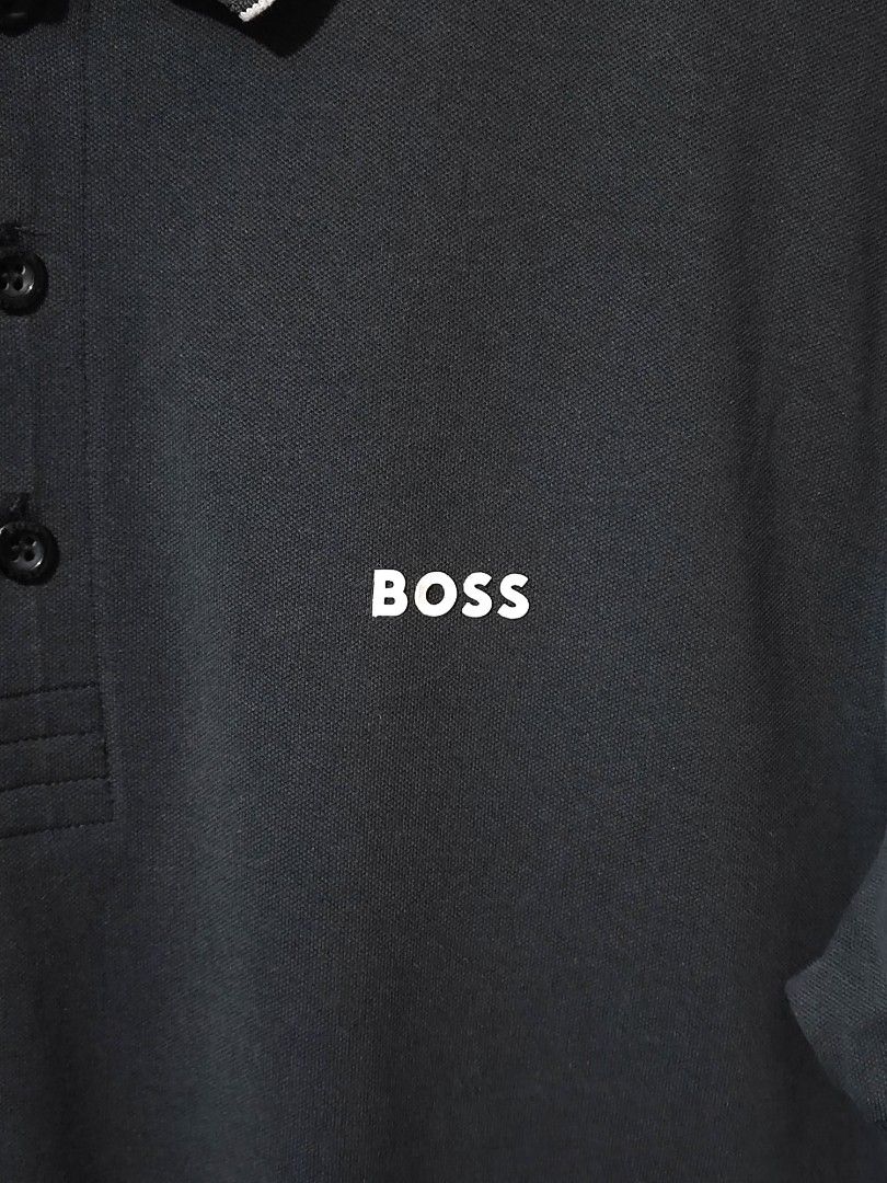 HUGO BOSS PAULE POLO SHIRT (Category: Tshirts & Polo Shirts ) located in Iloilo. Submitted by gooddimes (Listing ID 1471275980, Image 2). Description: Hugo Boss Paule Polo Shirt Authentic Slim Fit Stretch Size on tag: Medium Dimes: 20x28L Issue/s: Foldmark on collar Color rate: 8.8/10 Good condition ₱1,000 +sf Reminders: - All items are thrifted, please manage your expectations - Color may vary due to lighting - Please wash before using the item 