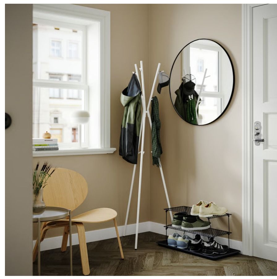 IKEA EKRAR hat and coat stand (Category: Shelves, Cabinets & Racks) located in Quezon City. Submitted by bananabreadish (Listing ID 1471238642, Image 1). Description: - Color & Material: Clean white metal finish - Space-Saving: Slim tripod base fits easily into room corners - Versatile Storage: Multiple hooks at various heights for coats, hats, bags, and scarves - Dimensions: Stands at 169 cm tall - Year bought: 2023/2026 at Php 1,990 RFS: Moving