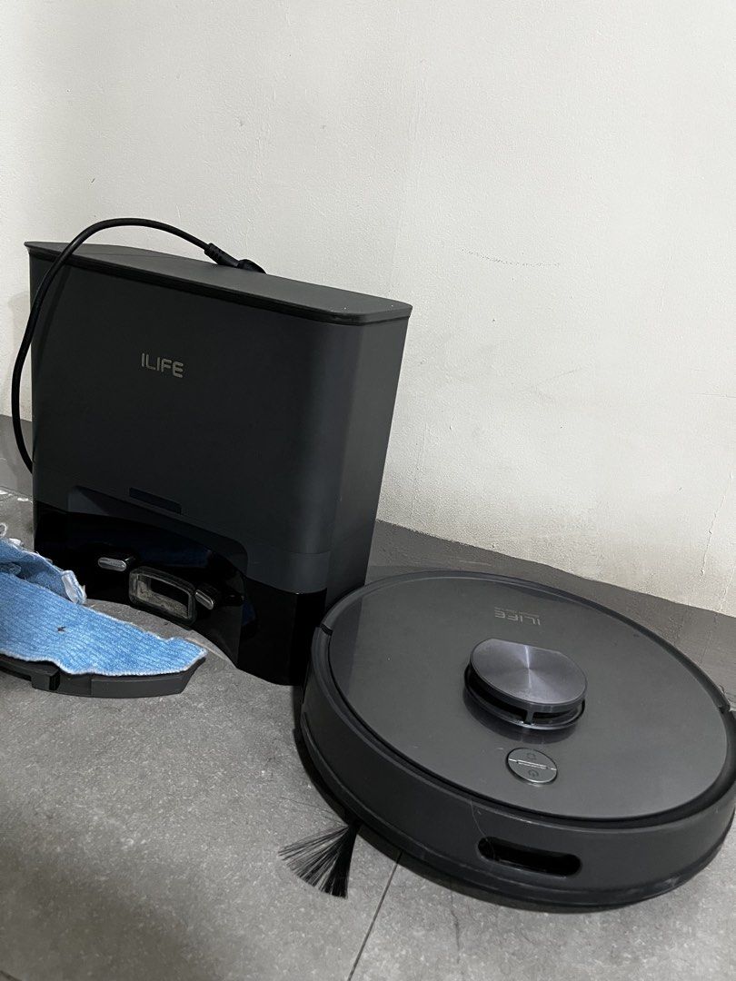 ILIFE Robot Vacuum and Mop with Auto-Empty Base (Category: Vacuum Cleaner & Housekeeping) located in Pasig City. Submitted by tomayto02 (Listing ID 1471157319, Image 3). Description: - Brand: ILIFE - Color: Dark Grey - Condition: Great working condition - Features: 2-in-1 vacuum and mop with hands-free cleaning - Dock: Automatic dust collection station with clean dust bag installed - Inclusions: Vacuum unit, side brush, and detachable mopping pad
