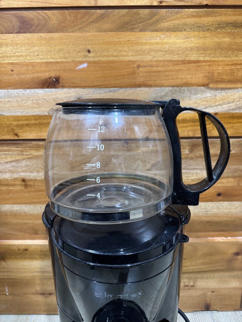 Imarflex 12-Cup Black Drip Coffee Maker (Category: Coffee Machines & Makers) located in Manila. Submitted by shijin_007 (Listing ID 1471282980, Image 3). Description: - Brand: Imarflex - Capacity: Up to 12 cups with glass carafe - Features: Clear side water level gauge (4-12 cups) and simple red power switch - Condition: Minor dust from storage, glass pot is fully intact with measurement markings - Plug: Standard plug-in cord attached - Minor iss