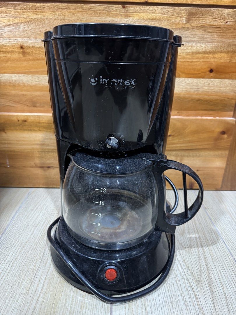 Imarflex 12-Cup Black Drip Coffee Maker (Category: Coffee Machines & Makers) located in Manila. Submitted by shijin_007 (Listing ID 1471282980, Image 1). Description: - Brand: Imarflex - Capacity: Up to 12 cups with glass carafe - Features: Clear side water level gauge (4-12 cups) and simple red power switch - Condition: Minor dust from storage, glass pot is fully intact with measurement markings - Plug: Standard plug-in cord attached - Minor iss