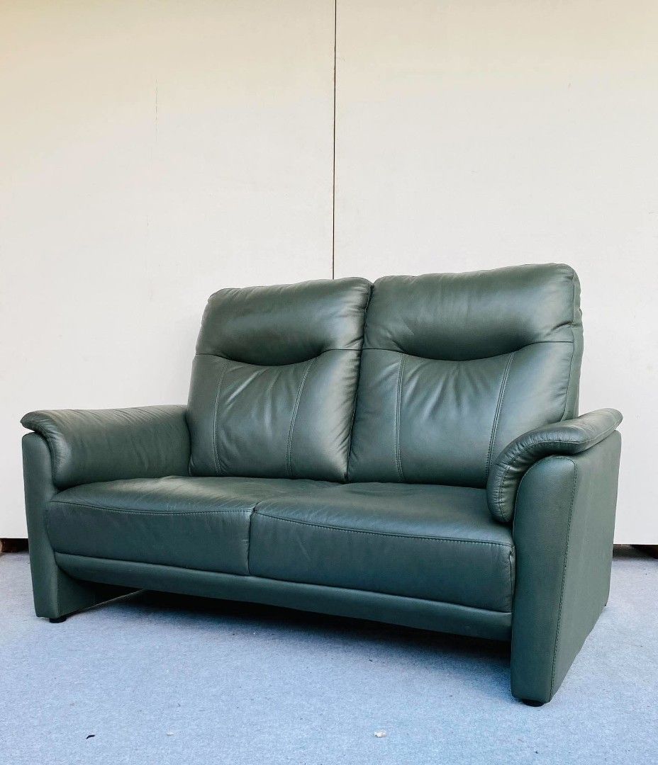 JAPAN SURPLUS" 2-SEATER HIGHBACK DARK GREEN LEATHER SOFA. (Category: Sofas) located in Bulacan. Submitted by junnie09 (Listing ID 1471181870, Image 2). Description: "JAPAN SURPLUS" 2-SEATER HIGHBACK DARK GREEN LEATHER SOFA. SIZE: 56L" x 36W" x 16Sh" x 37H" inches. (AS-IS ITEM) IN GOOD CONDITION.