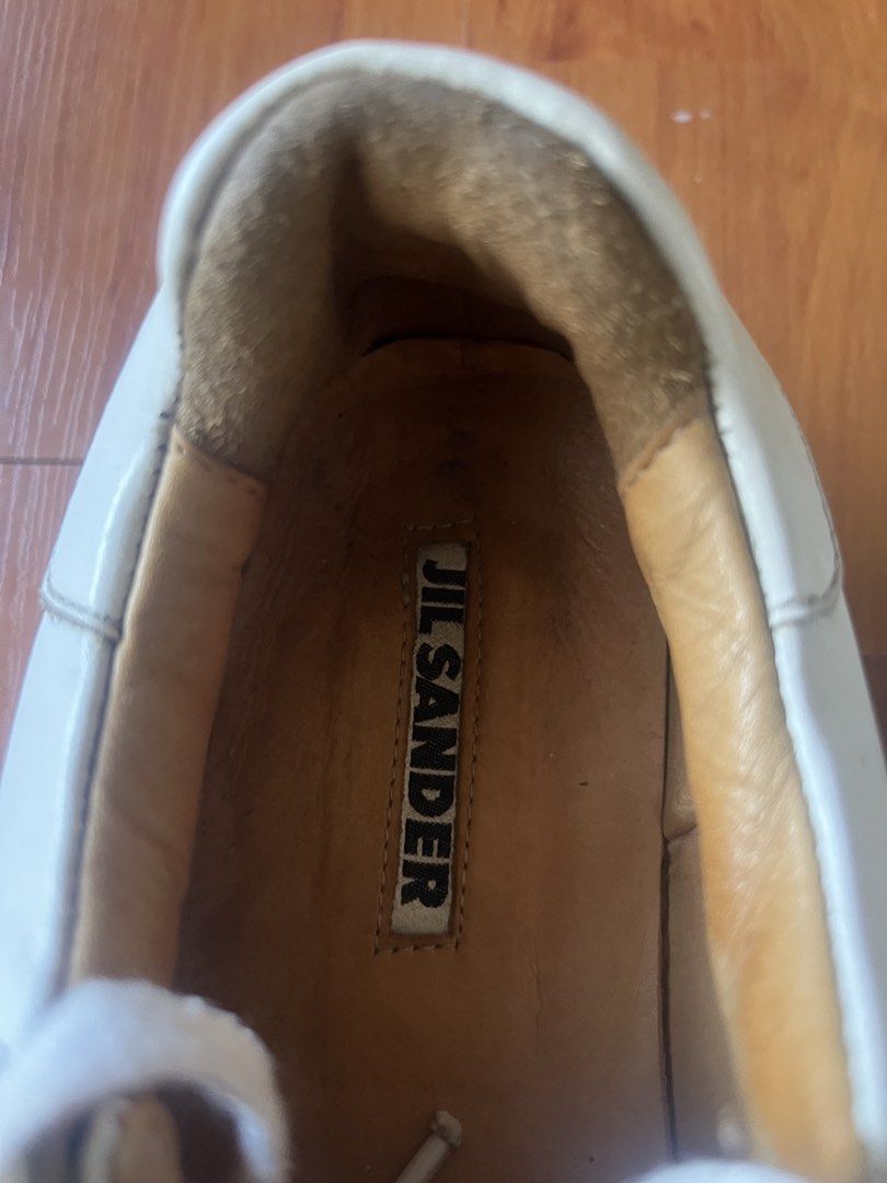 Jil Sander Off-White Leather Chunky Ribbed Platform Sneakers (Category: Sneakers) located in Lipa City. Submitted by alexcollectionco (Listing ID 1471283679, Image 3). Description: Authentic luxury platform sneakers from Jil Sander. Features thick, premium off-white leather uppers, plush tan leather interior lining with stamped branded insoles, and Jil Sander’s iconic heavy ribbed/grooved vulcanized platform rubber soles. Delivers a bold minimali