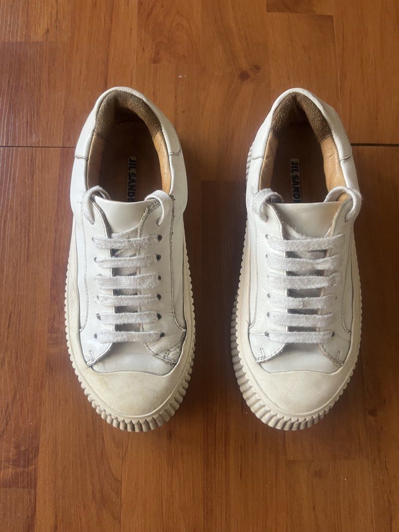 Jil Sander Off-White Leather Chunky Ribbed Platform Sneakers (Category: Sneakers) located in Lipa City. Submitted by alexcollectionco (Listing ID 1471283679, Image 2). Description: Authentic luxury platform sneakers from Jil Sander. Features thick, premium off-white leather uppers, plush tan leather interior lining with stamped branded insoles, and Jil Sander’s iconic heavy ribbed/grooved vulcanized platform rubber soles. Delivers a bold minimali