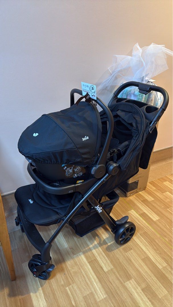 Joie Black Stroller with Infant Car Seat Bundle (Category: Strollers) located in Makati City. Submitted by ritt28 (Listing ID 1471160975, Image 1). Description: - Brand: Joie Stroller Set - Color: Solid Black (Clean fabric throughout) - Includes: Compatible infant car seat - Convenience: Parent tray with built-in cup holders - Storage: Spacious under-seat basket for bags and essentials - Performance: Sturdy frame with smooth wheels - Condition: W